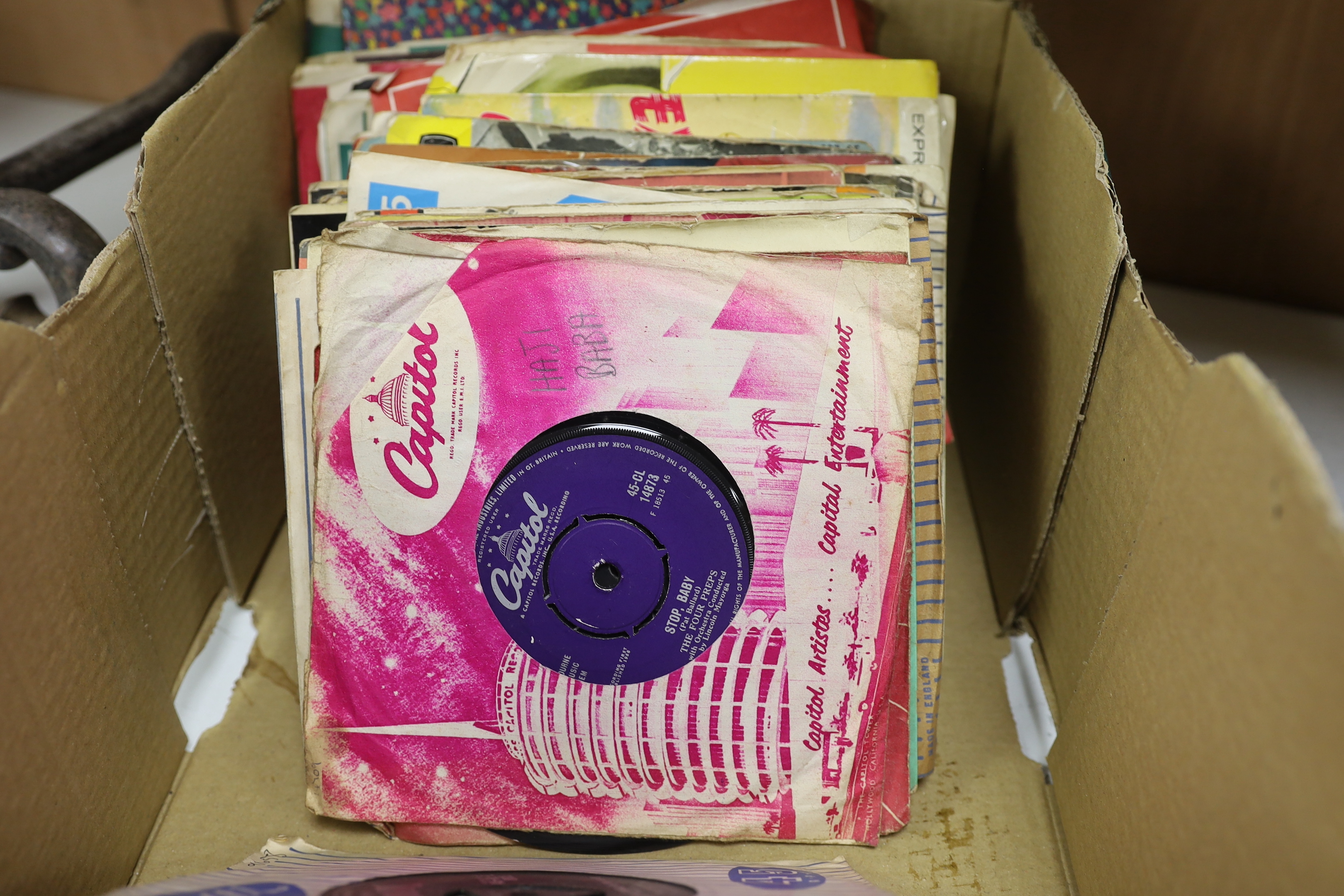 A collection of 45rpm 7 inch singles, artist include Elvis Presley, the Beatles, Creedence Clearwater Revival, T-Rex, Tom Jones, Cat Stevens, etc. (nine Beatles singles)